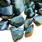 Edge-on view of Kambaba Jasper tumbled stone, showing matte finish, drawn on for Grounding.