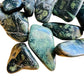 Magnified detail of Kambaba Jasper tumbled stone, showing natural sheen, sourced from Madagascar.