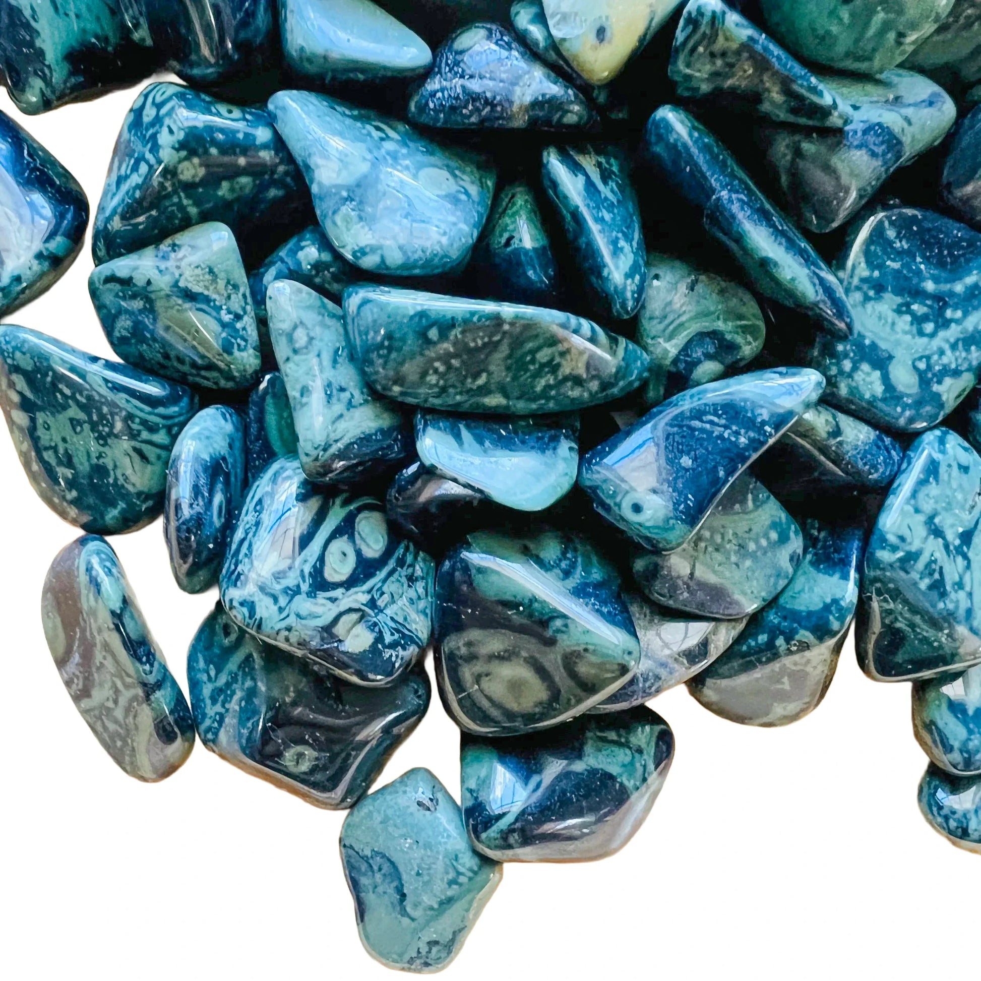 Close-up of Kambaba Jasper tumbled stone, showing natural inclusions, carried for Grounding and Stress Relief.