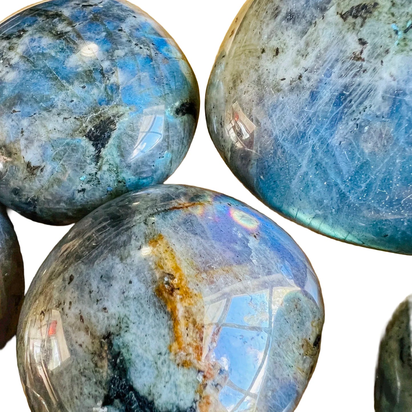 Underside detail of Labradorite palm stone, traditionally used for Intuition and Protection, showing natural texture.