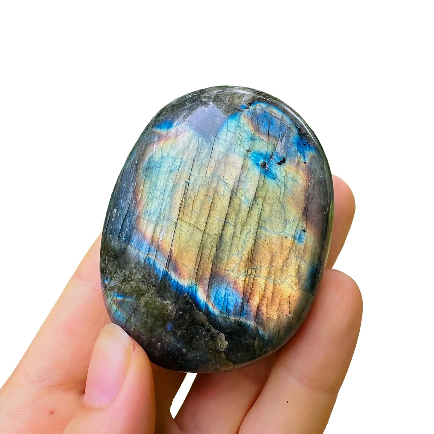 Side-on view of Labradorite palm stone, showing natural inclusions.