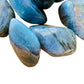 Texture-level view of Labradorite tumbled stone, showing glassy finish.