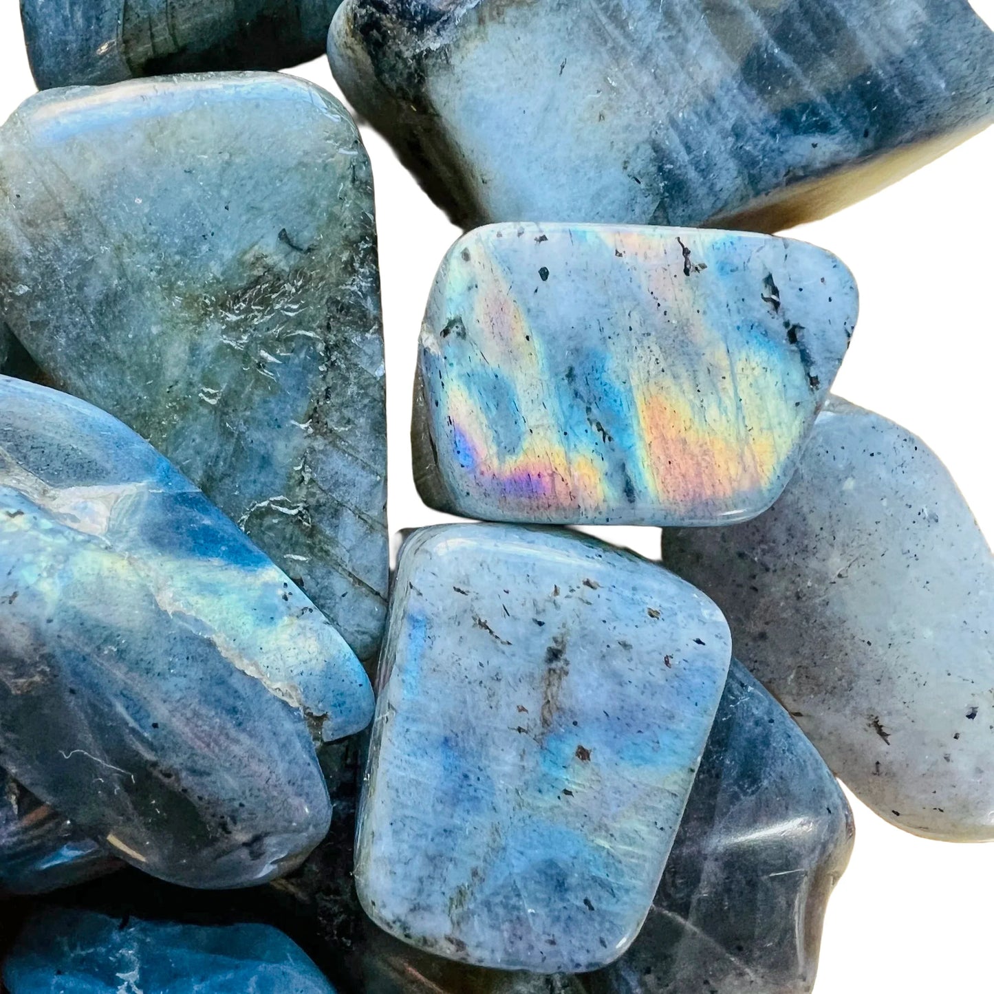 Macro view of Grade AA gray Labradorite tumbled stone, showing soft luster, hand-selected from Atsimo-Andrefana, Madagascar.