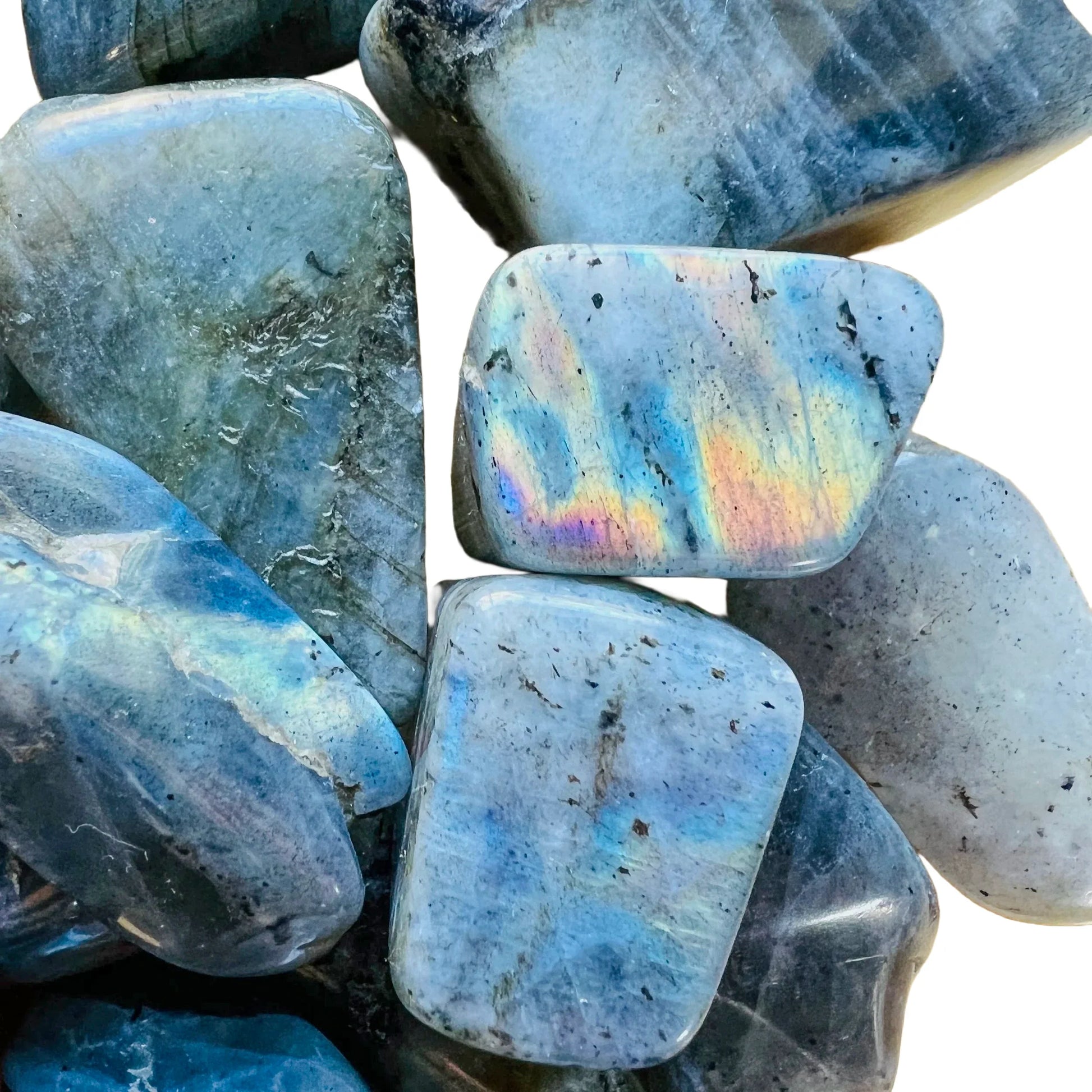 Macro view of Grade AA gray Labradorite tumbled stone, showing soft luster, hand-selected from Atsimo-Andrefana, Madagascar.