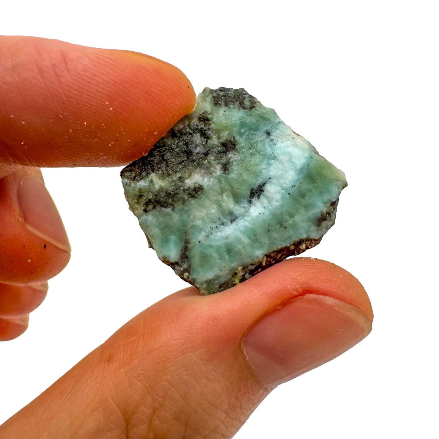 Natural light context of Larimar raw crystal, from Barahona Province, Dominican Republic, linked to Love, set to give a sense of weight.