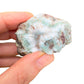 Top-down shot of blue Larimar raw stone, hand-selected from Barahona Province, Dominican Republic, worked with for Stress Relief.