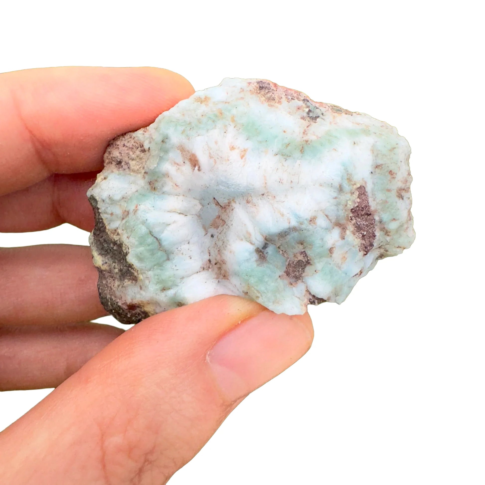 Top-down shot of blue Larimar raw stone, hand-selected from Barahona Province, Dominican Republic, worked with for Stress Relief.