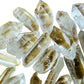 Side-on view of clear Lemurian Quartz raw point, showing characteristic finish.