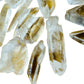 Top-down shot of Grade AA Lemurian Quartz raw point, showing characteristic patterning, for Meditation and Intuition.