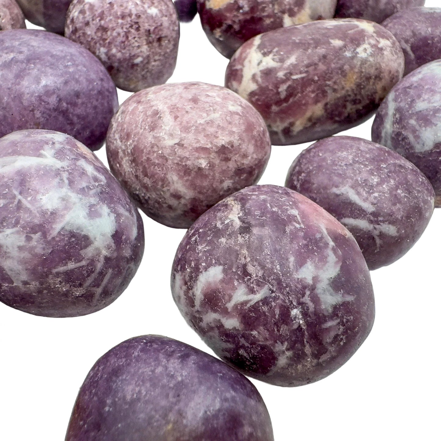 Top view of Lepidolite tumbled stone, showing characteristic finish.