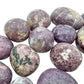 Underside detail of purple Lepidolite tumbled stone, linked to Stress Relief, showing characteristic finish.