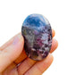 Top-side view of Lepidolite palm stone, showing characteristic patterning, sourced from Vakinankaratra, Madagascar.