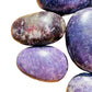 Worktop view of Lepidolite palm stone, from Vakinankaratra, Madagascar, shown for shape and scale.
