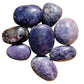 Detail shot of Grade AA Lepidolite palm stone under natural light