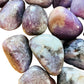 Side angle of Lepidolite tumbled stone, showing characteristic finish.