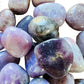 Bottom side of Lepidolite tumbled stone, turned to for Stress Relief and Emotional Healing.