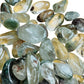 Reverse side of Lodolite tumbled stone, showing natural sheen.