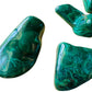 Back view of Grade AA Malachite tumbled stone showing natural surface