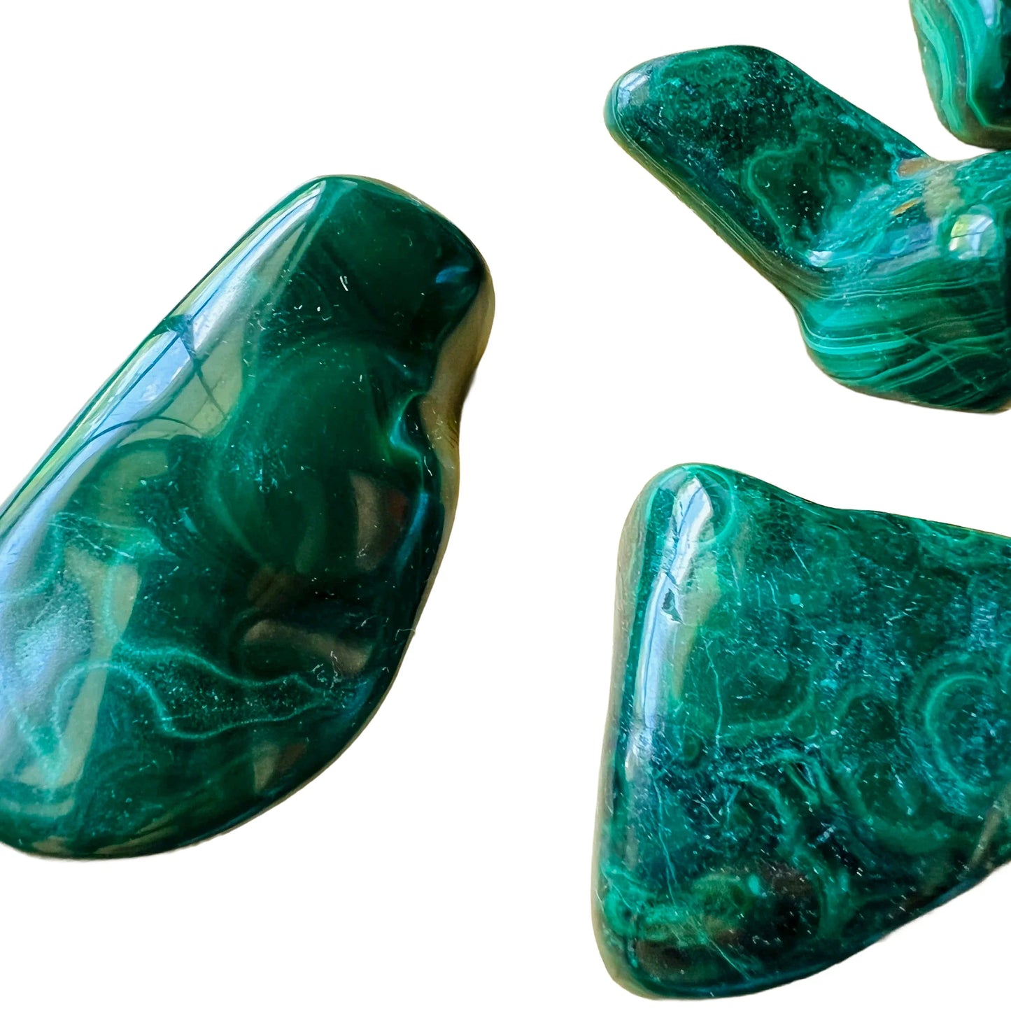 Back view of Grade AA Malachite tumbled stone showing natural surface