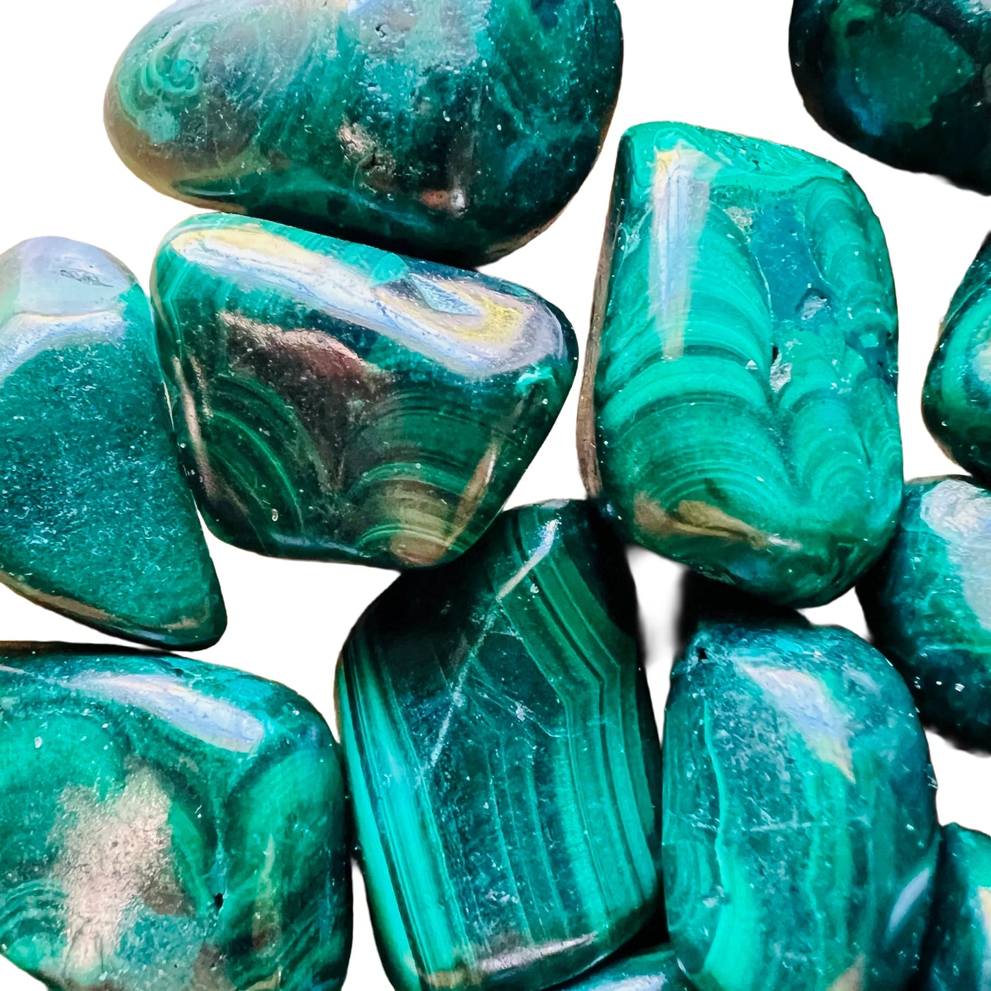 Edge view of Malachite tumbled stone, kept near for Emotional Healing and Protection.