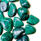 Near view of Malachite tumbled stone, often worked with for Emotional Healing.