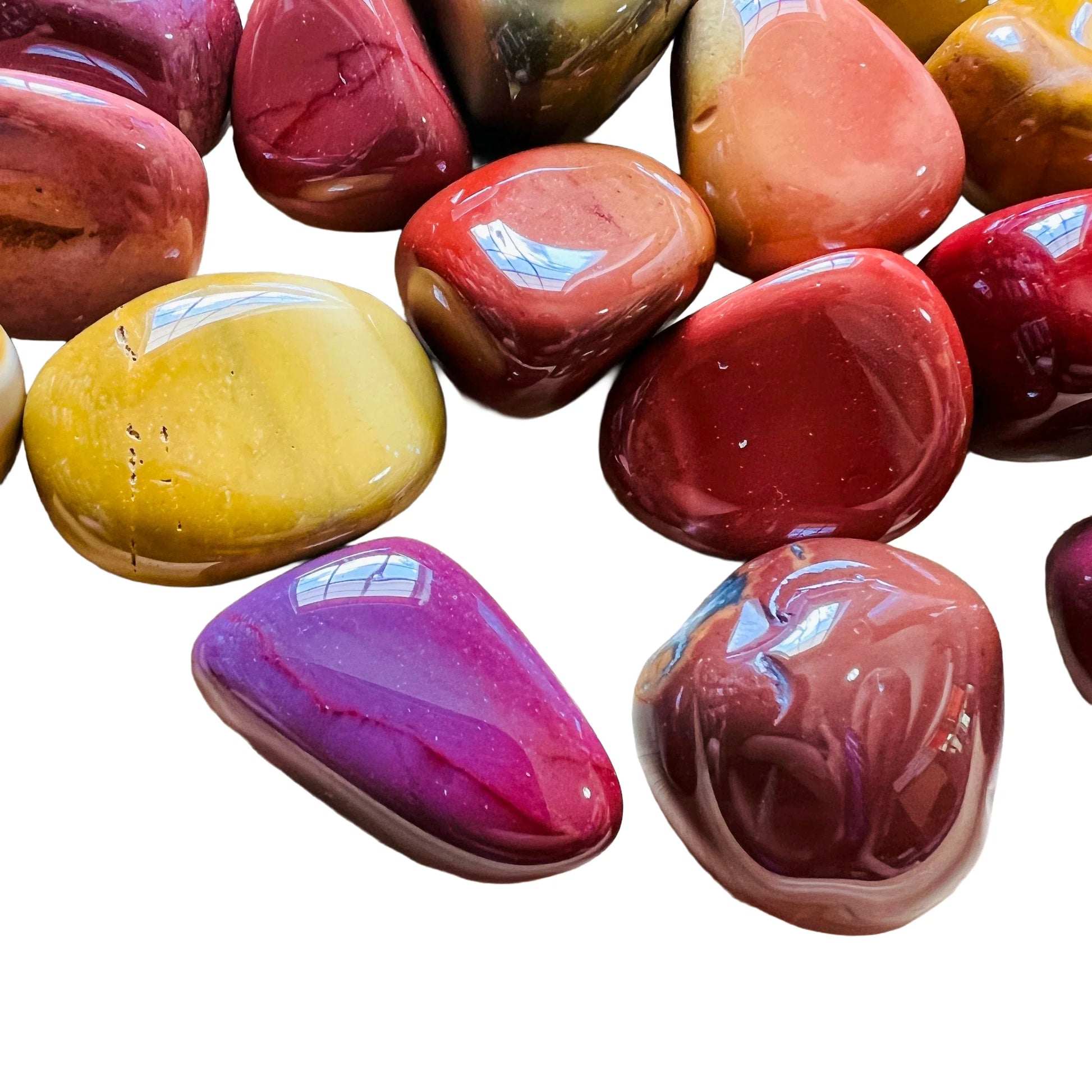 Surface detail of Mookaite tumbled stone, sourced from Australia, carried for Grounding.