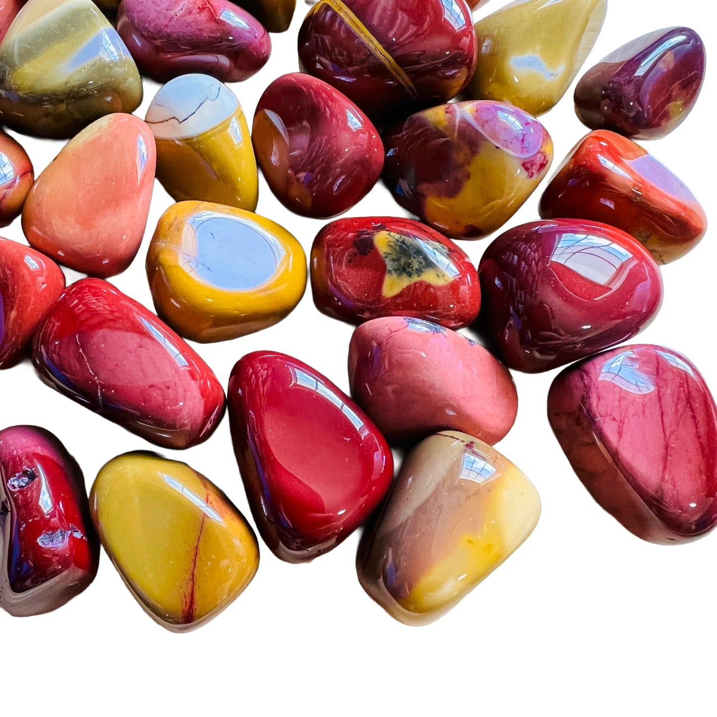Top angle of Mookaite tumbled stone, often kept for Grounding.
