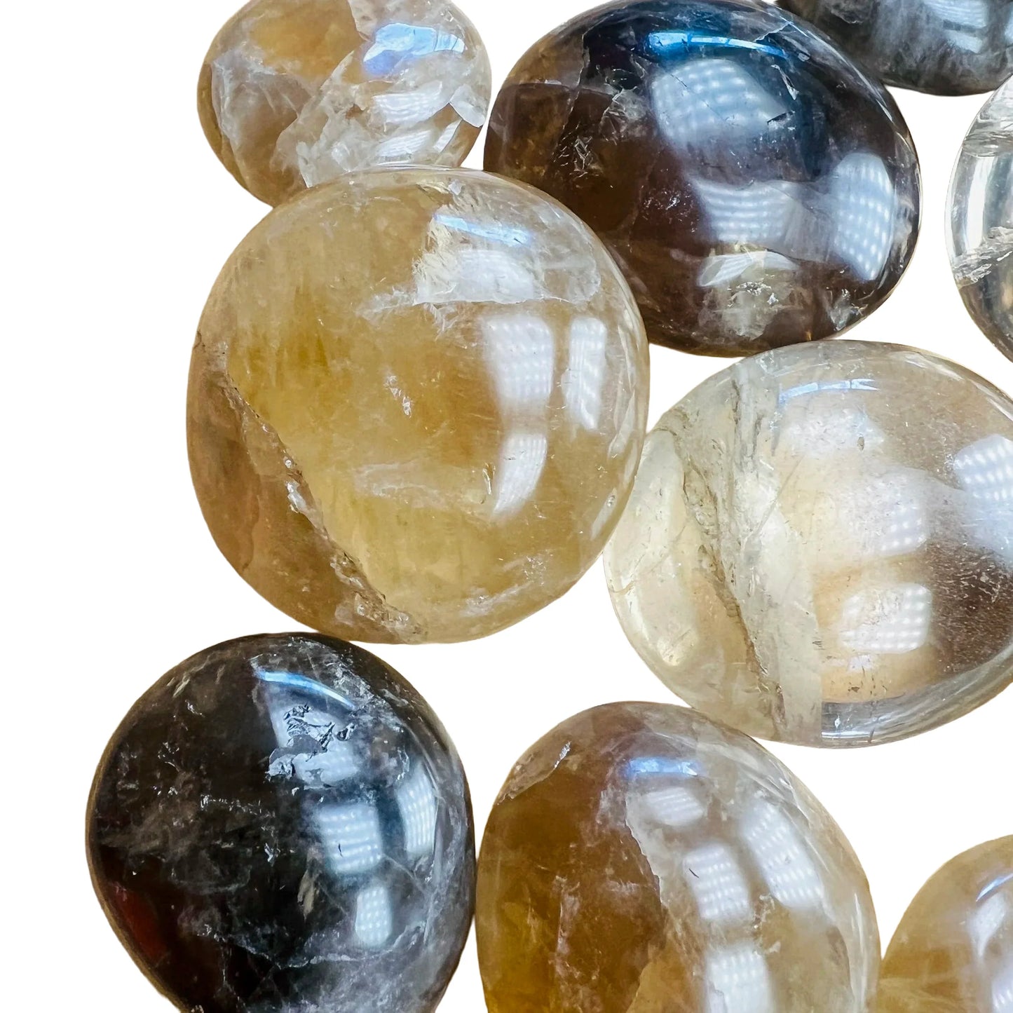 Side profile of Grade A Natural Citrine palm stone, sourced from Madagascar, showing characteristic finish.