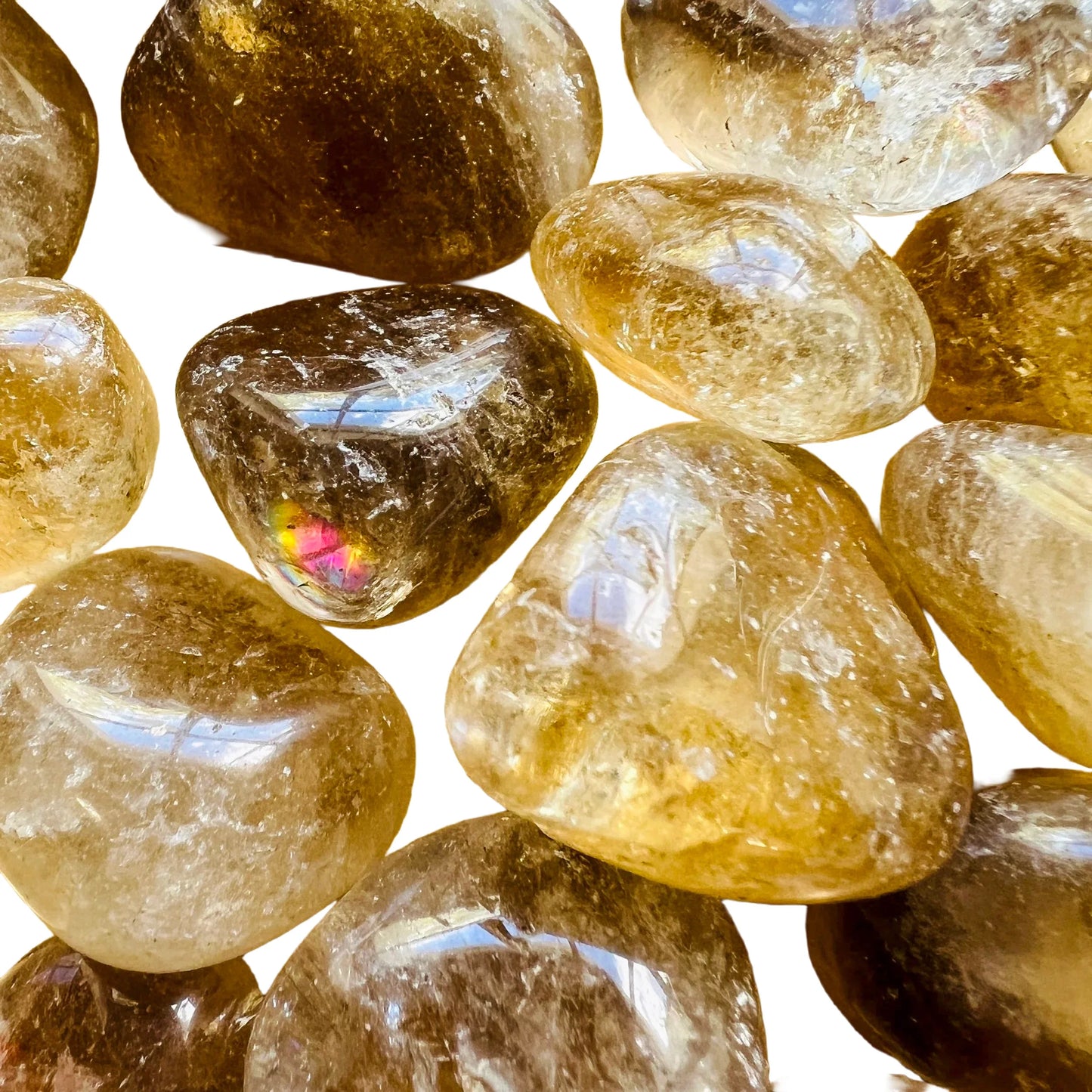 Magnified detail of Natural Citrine tumbled stone, sourced from Minas Gerais, Brazil, often paired with practices around Abundance.