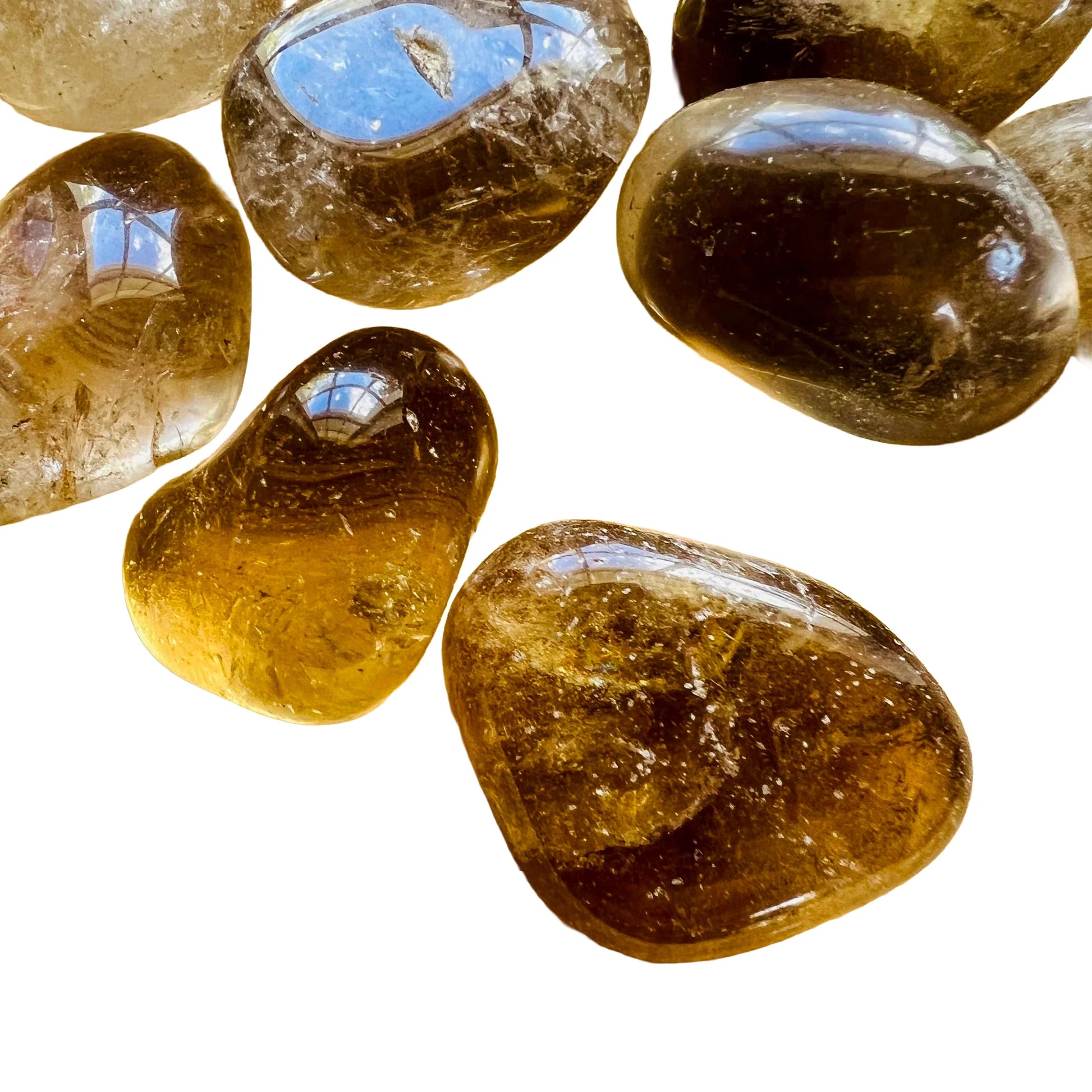 Side perspective of Natural Citrine tumbled stone, sourced from Minas Gerais, Brazil, showing natural texture.