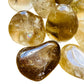 Reverse angle of Natural Citrine tumbled stone, sourced from Minas Gerais, Brazil, turned to for Abundance.