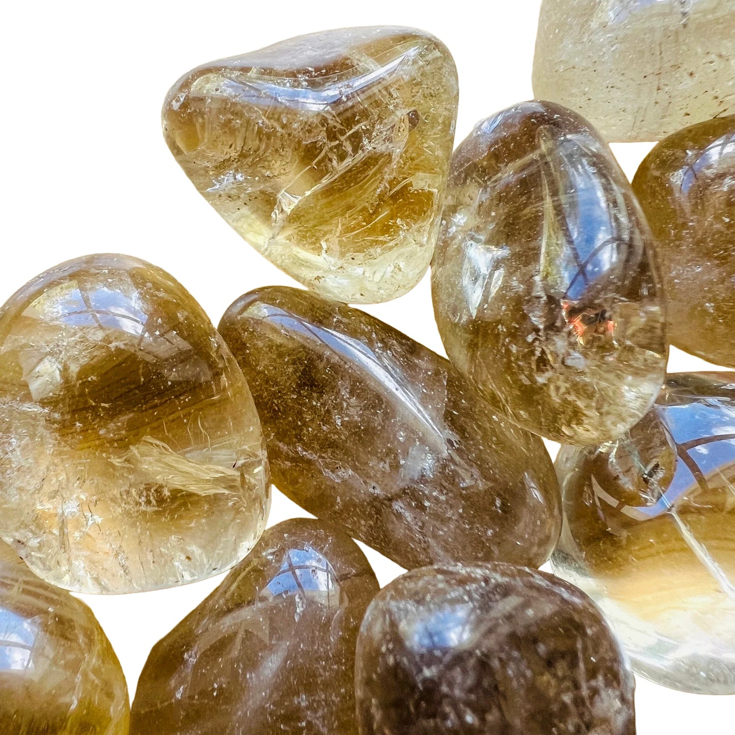 Size comparison with a single Natural Citrine tumbled stone Brazil-sourced, Brazil-sourced.