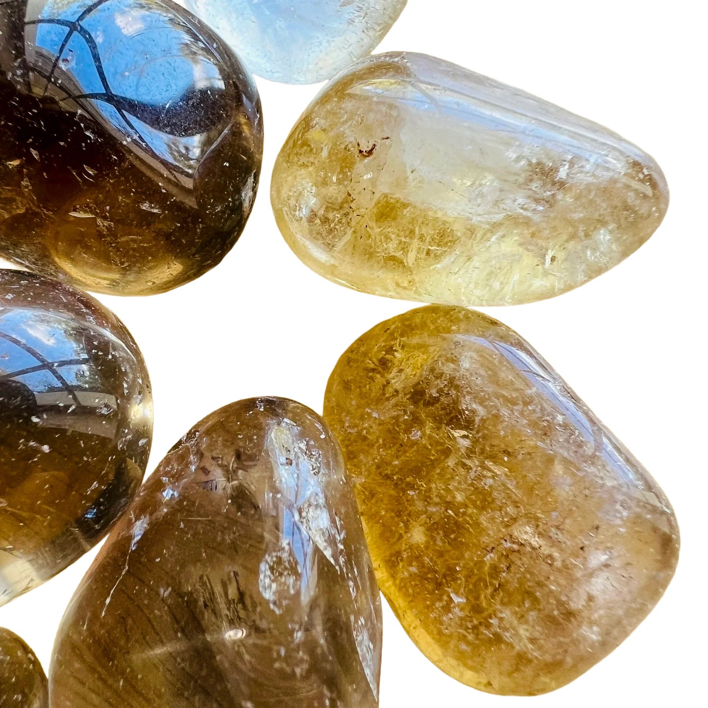 Lateral view of Natural Citrine tumbled stone, traditionally used for Abundance and Manifestation, sourced from Brazil.