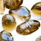 Natural light view of a single Natural Citrine tumbled stone from Brazil.