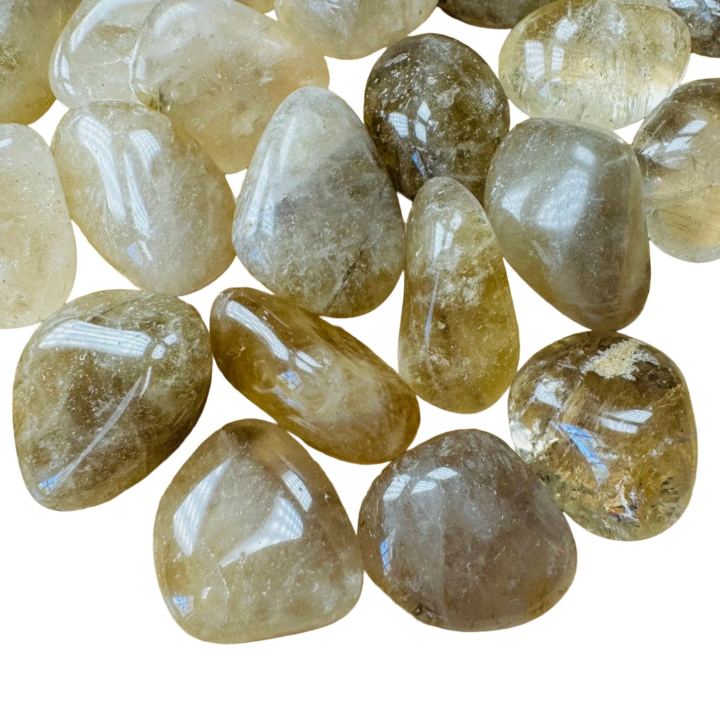 Detail capture of Natural Citrine tumbled stone, for Abundance, showing natural variation.