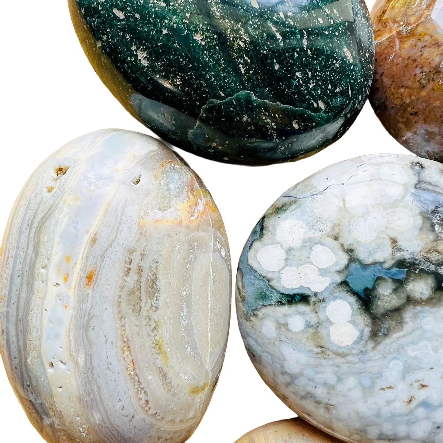 Lateral view of Ocean Jasper palm stone, hand-selected from Sofia, Madagascar, showing natural texture.