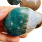 Back view of Grade AA Ocean Jasper palm stone showing natural surface