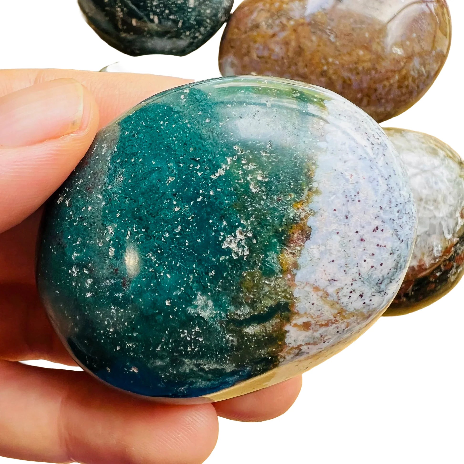 Back view of Grade AA Ocean Jasper palm stone showing natural surface