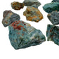 Sideways view of green Ocean Jasper raw stone, from Madagascar, showing natural inclusions.