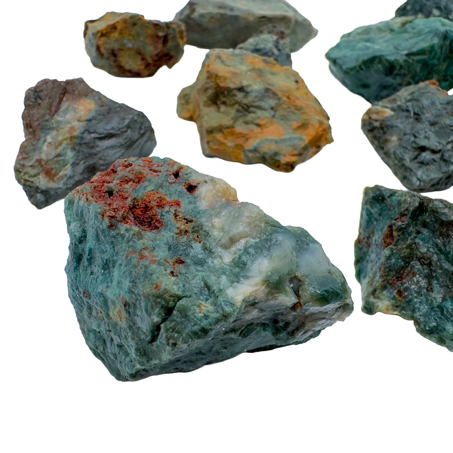 Sideways view of green Ocean Jasper raw stone, from Madagascar, showing natural inclusions.