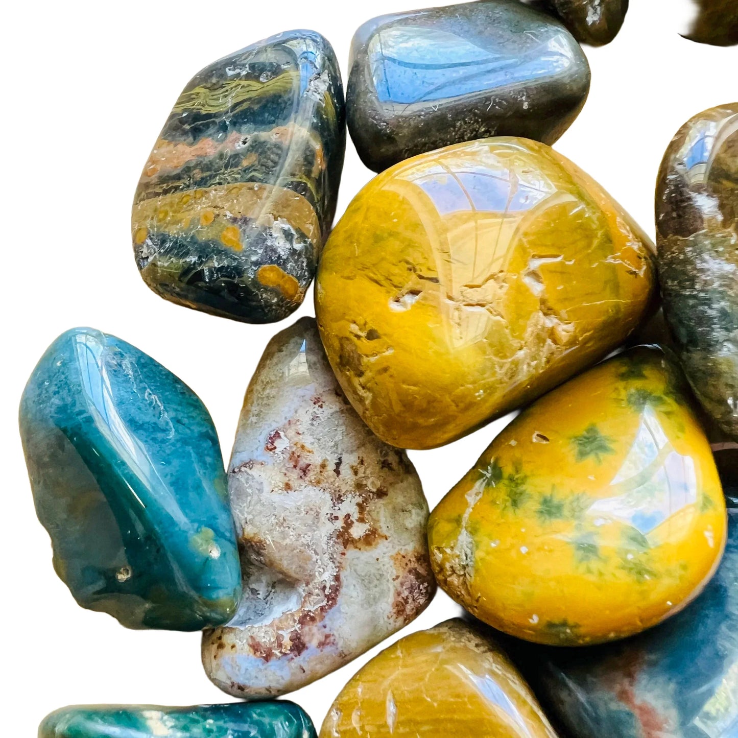 Lateral view of Ocean Jasper tumbled stone, sourced from Madagascar, showing earthy tone.