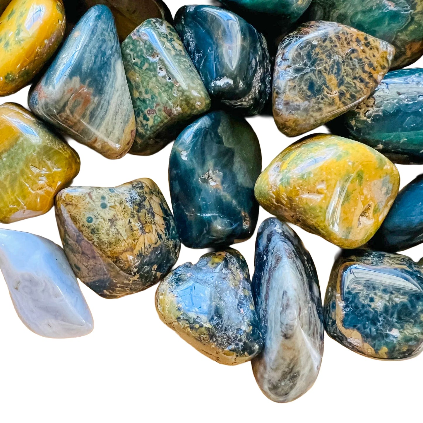Overhead angle of Grade A green Ocean Jasper tumbled stone, showing soft luster, worked with for Emotional Healing.