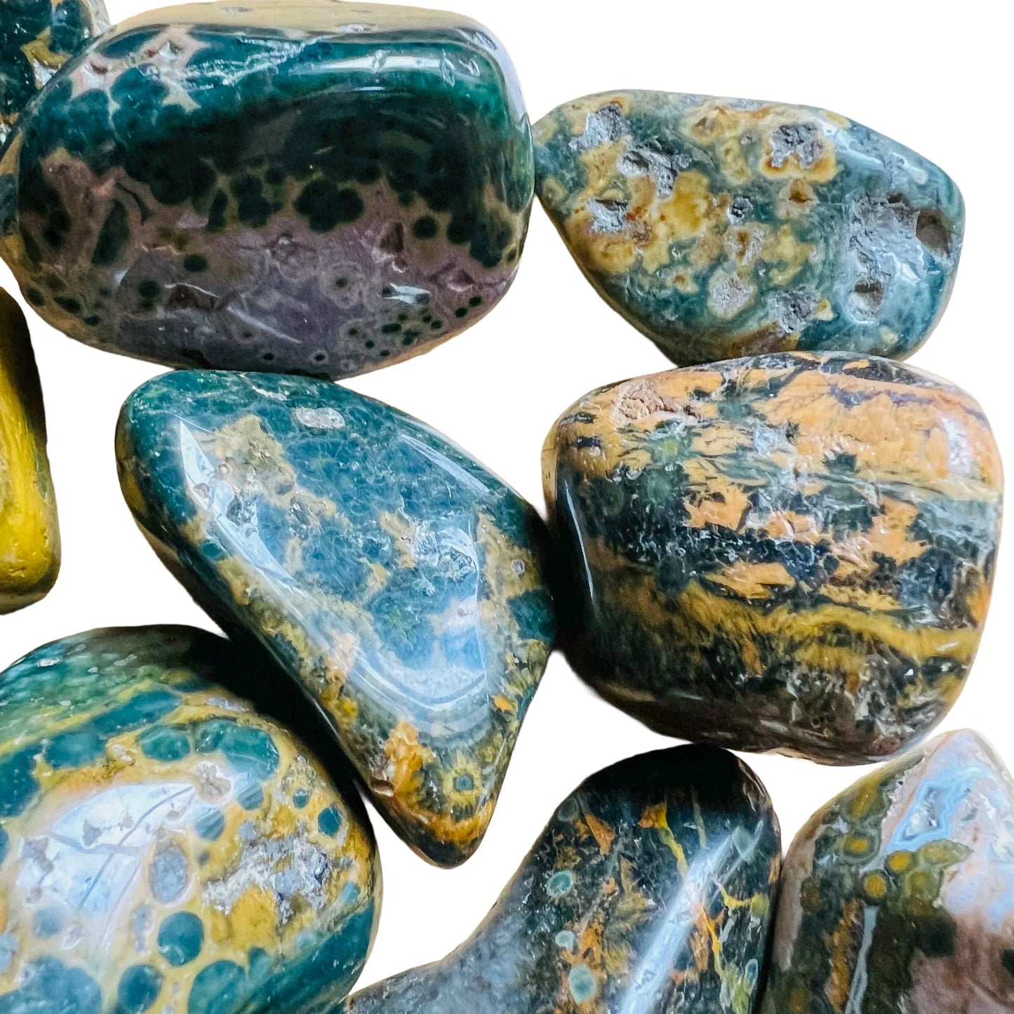 Scale reference of one Ocean Jasper tumbled stone for scale, sourced from Sofia, Madagascar.