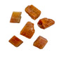 Up-close view of Orange Calcite raw stone, showing natural texture.