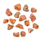 Detail shot showing Orange Calcite raw stone, sourced from Betsiboka, Madagascar, showing raw matrix.