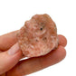 Back view of Grade A Orange Calcite raw showing natural surface