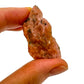 Detail shot of Grade A Orange Calcite raw under natural light