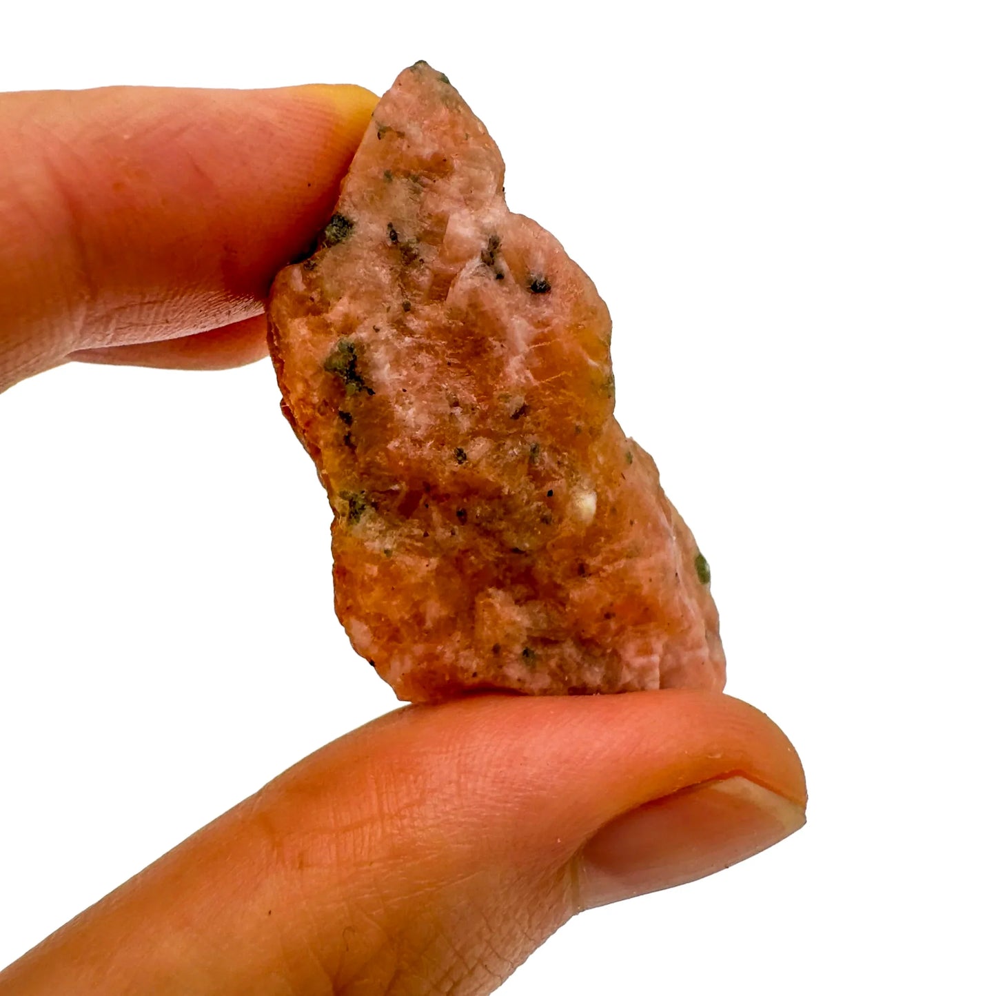 Detail shot of Grade A Orange Calcite raw under natural light