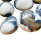 Color detail of Grade AA Orca Agate palm stone, often kept for Stress Relief and Emotional Healing, from Sofia, Madagascar.