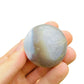 In context of an Orca Agate palm stone, from Sofia, Madagascar, shown for size reference.